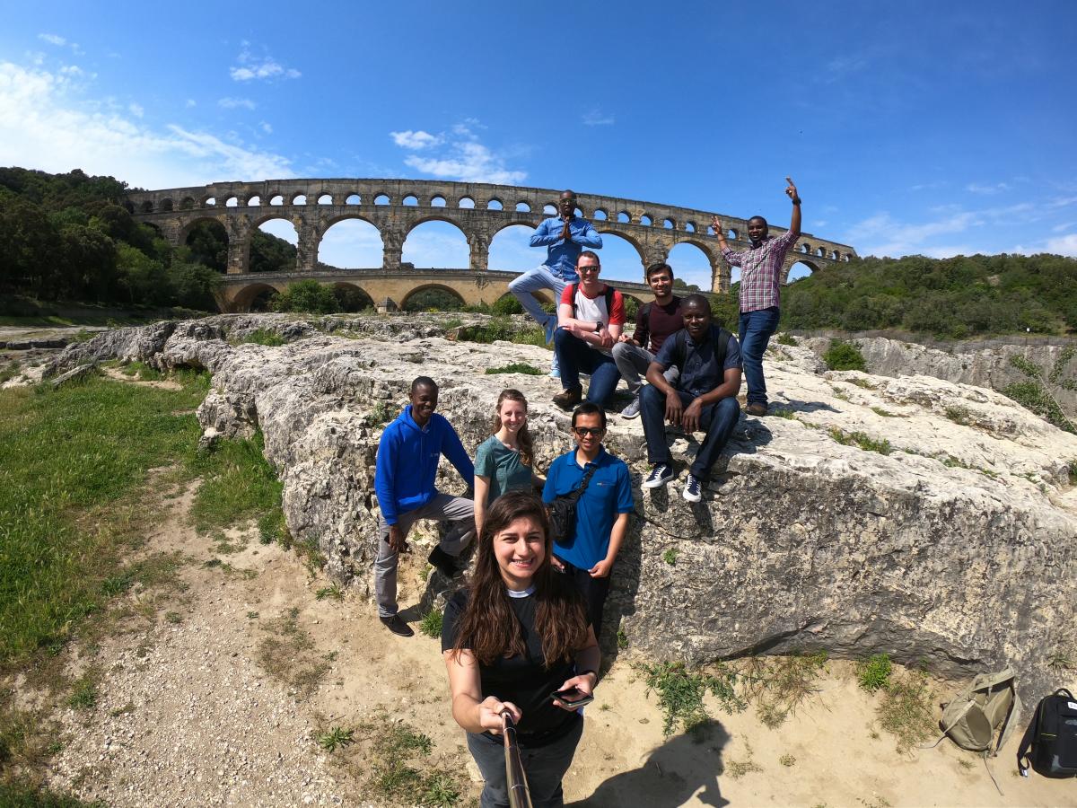 students before the Pont du Gard bridge